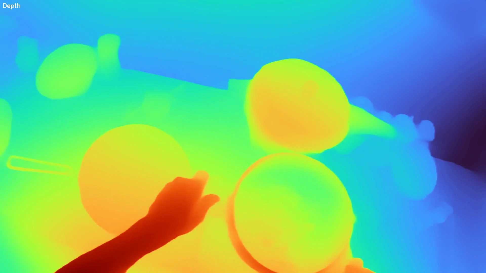 Depth map of an egocentric scene with objects and a hand